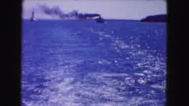 Buffalo New York USA (1961): Shoreline Of A City Cut To Trailing Shot Of A Boat