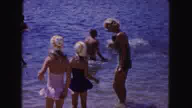 Buffalo New York USA (1961): Women And Children Play In The Ocean Together And Go