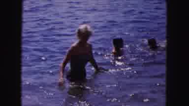 Buffalo New York USA (1961): Family Plays With Children At The Ocean
