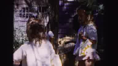 Buffalo New York USA (1961): Mother Daughter Near Tree Petting Animals At Zoo For