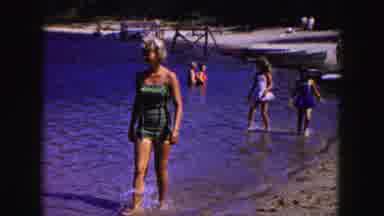 Buffalo New York USA (1961): Blonde Woman Wearing One Piece Bathing Suit Wades