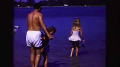 Buffalo New York USA (1961): Dad And Two Daughters On Beach Walking On Sand And