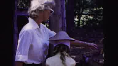 Buffalo New York USA (1961): Daughter And Grandmother Pet And Feed A Deer Behind A