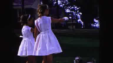 Buffalo New York USA (1961): Two Little Girls Wearing White Dresses And Playing