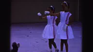 Buffalo New York USA (1961): Girls Wearing White Dresses Perform Trick With Light