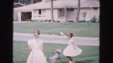 Buffalo New York USA (1961): Two Girls In Cute White Dresses Playing With A Small