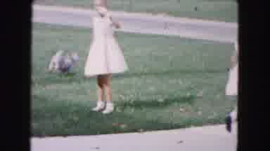 Buffalo New York USA (1961): Two Girls Playing With There Dog Outside On The Green
