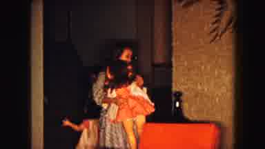 Buffalo New York USA (1961): Two Young Girls Walking Through A Hallway Carrying