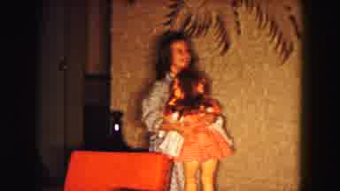 Buffalo New York USA (1961): Smiling Girl In Nightgown Carrying A Large Doll