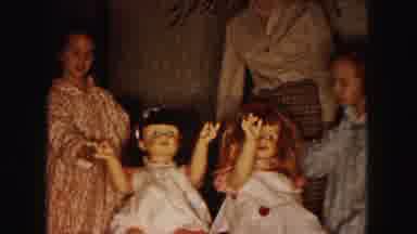 Buffalo New York USA (1961): Young Girls Playing With Their Walking Dolls And