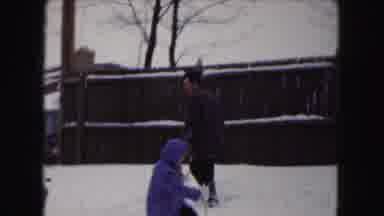 Buffalo New York USA (1961): A Parent And Their Child Skiing Together