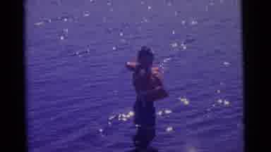 Camden New Jersey USA (1961): Young Boy Playing In The Middle Of Water With Orange