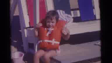 Camden New Jersey USA (1961): A Little Girl Putting On Life Jacket Before Going In