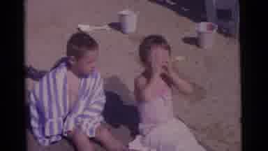 Camden New Jersey USA (1961): Young Children Sitting On The Beach Wrapped In