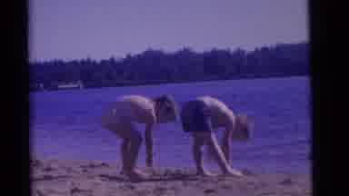 Camden New Jersey USA (1961): Two Toddlers Play In Sand Beside A Blue Lake Or