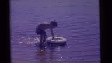 Camden New Jersey USA (1961): Little Boy Playing With Inflatable Toy In Shallow