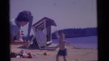 Camden New Jersey USA (1961): Child On The Beach Playing Baseball With Parent And