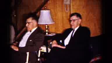 Hagerstown Maryland USA (1961): Inside A Room Men And Women Dressed Formally