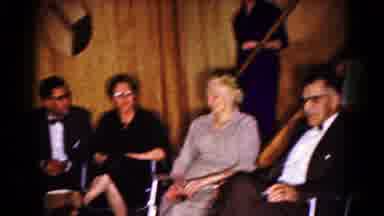 Hagerstown Maryland USA (1961): Formally Dressed Adults Sitting In A Basement With
