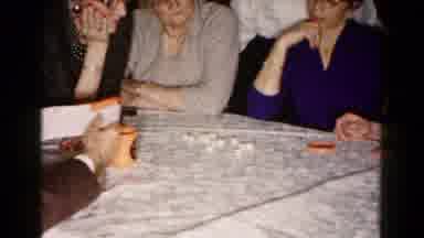 Hagerstown Maryland USA (1961): A Man Reading Instructions Of A Dice Game To Three