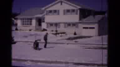 Hagerstown Maryland USA (1961): A Young Man Pulling Another Young Man On A Sled