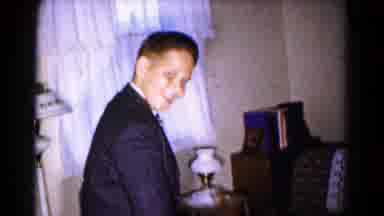 Hagerstown Maryland USA (1961): Teenage Boy Joyfully Pick Up Toys From Coffee