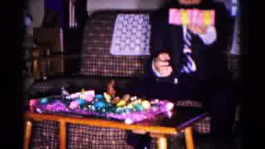 Hagerstown Maryland USA (1961): A Man Is Holding A Present Then The Girl Comes