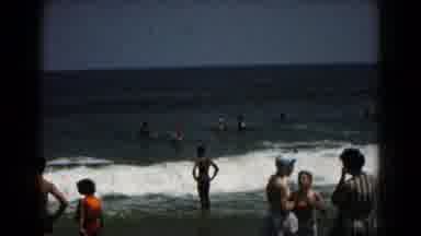 Hagerstown Maryland USA (1961): People Standing In Incoming Ocean Surf On A Bright