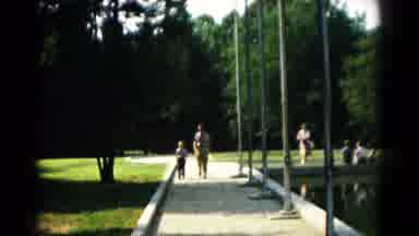 Hagerstown Maryland USA (1961): A Man And His Young Boy Walking Alongside A