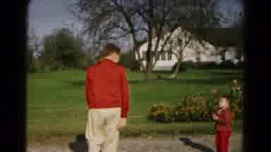 Hagerstown Maryland USA (1961): A Father And His Child Are Playing In The Garden