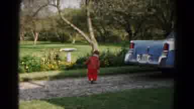Hagerstown Maryland USA (1961): Small Child Tossing A Stone Down A Driveway Behind