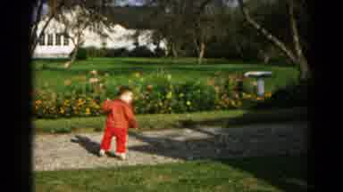 Hagerstown Maryland USA (1961): Child In Red Outfit Running And Turning Around