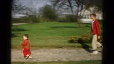 Hagerstown Maryland USA (1961): A Man In A Red Sweater Follows A Small Boy Running