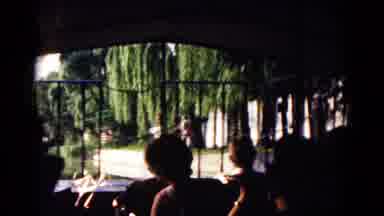 Hagerstown Maryland USA (1961): Woman Riding Through Gate In A Car With Trees In