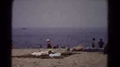 Hagerstown Maryland USA (1961): People Lounge At Beach On Blankets As Small Waves