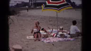 Hagerstown Maryland USA (1961): Three People Lounging On A Beach And Four People