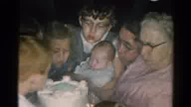 Catskill New York US (1962): Family Blowing Out Candles On A Grandmother's