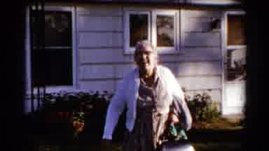 Catskill New York US (1962): Smiling Overweight Elderly Woman Leaving House With