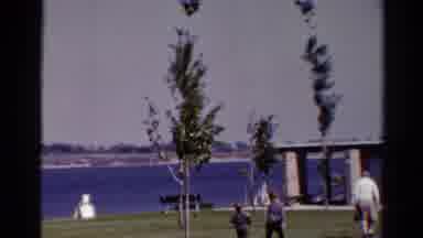 Catskill New York US (1962): Kids Running Around Playing On A Windy Day While Old