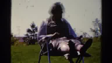 Catskill New York US (1962): Old Man Laying In Back Yard Watching His Neighbors A