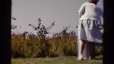 Catskill New York US (1962): Woman Setting A Picnic Table In A Clearing Of A Field