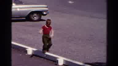 Catskill New York US (1962): A Child Attempting And Failing At Balancing On A Thin