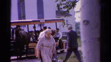 Catskill New York US (1962): Old Woman Walking With Horse Drawn Trolley In