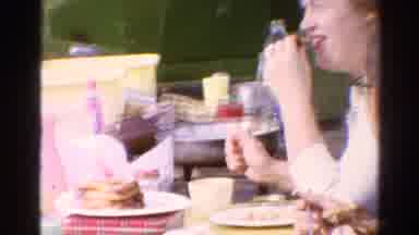 Catskill New York US (1962): A Family Eating Talking And Laughing Outdoors On A