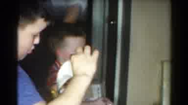 Catskill New York US (1962): Two Boys Asking Daddy For Help At Family Function