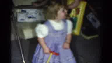 Catskill New York US (1962): Girl Wearing Blue Dress Looks Up At Passing Person