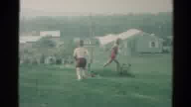 Catskill New York US (1962): Several Children Run Around In A Field With Suburban