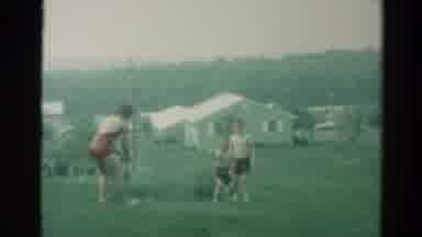 Catskill New York US (1962): Three Kids Wearing Bathing Suits Playing In A