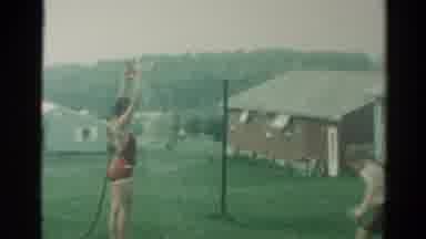 Catskill New York US (1962): Children Playfully Cooling Off In The Back Yard