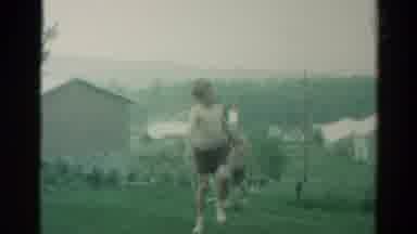 Catskill New York US (1962): Children Playing In The Yard Under A Sprinkler In Hot